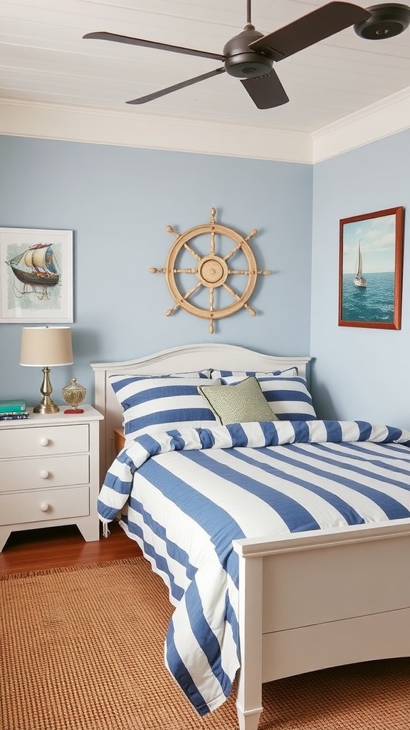 A cozy nautical-inspired bedroom featuring striped bedding, a ship's wheel decor, and soft blue walls.